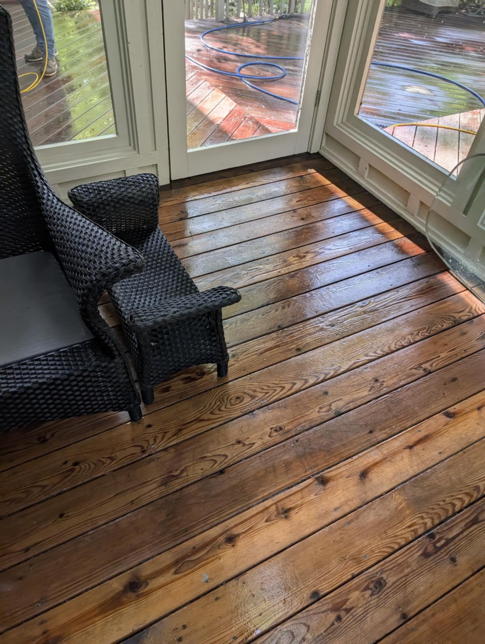 Clean sunroom deck with restored wood grain